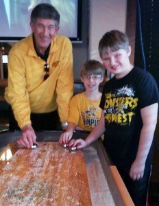 Gary Patterson and Kody playing shuffleboard at Jerseys